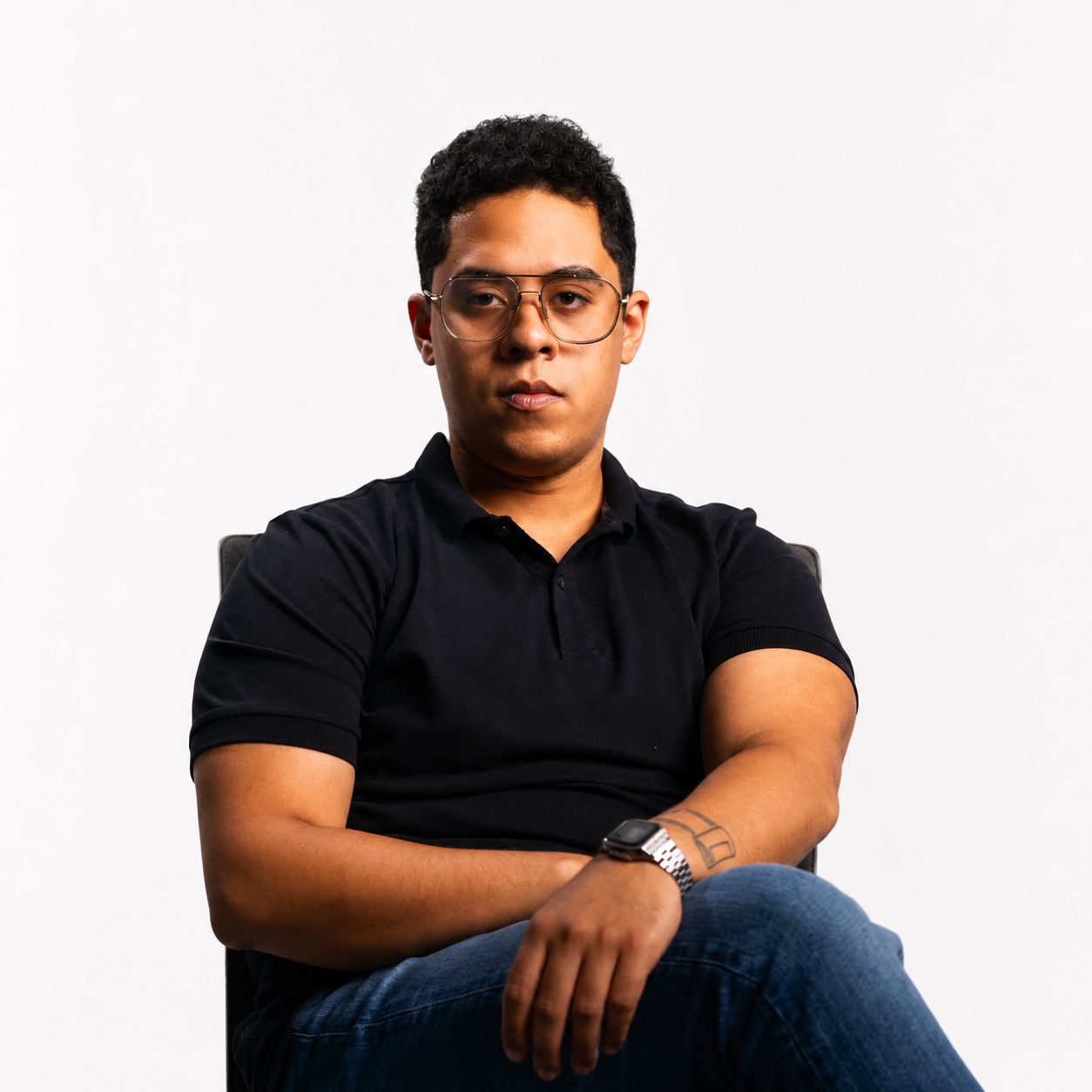 Professional portrait of a team member in a creative studio environment.