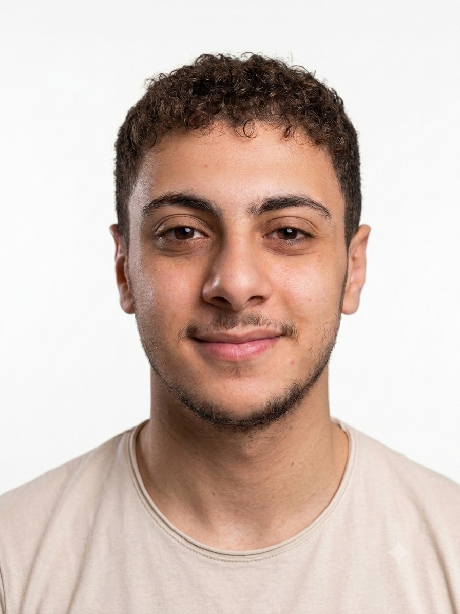 Professional portrait of a team member in a creative studio environment.